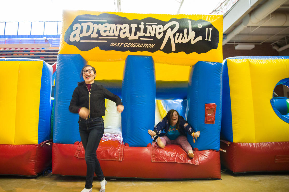 Students play on one of the the inflatable games.