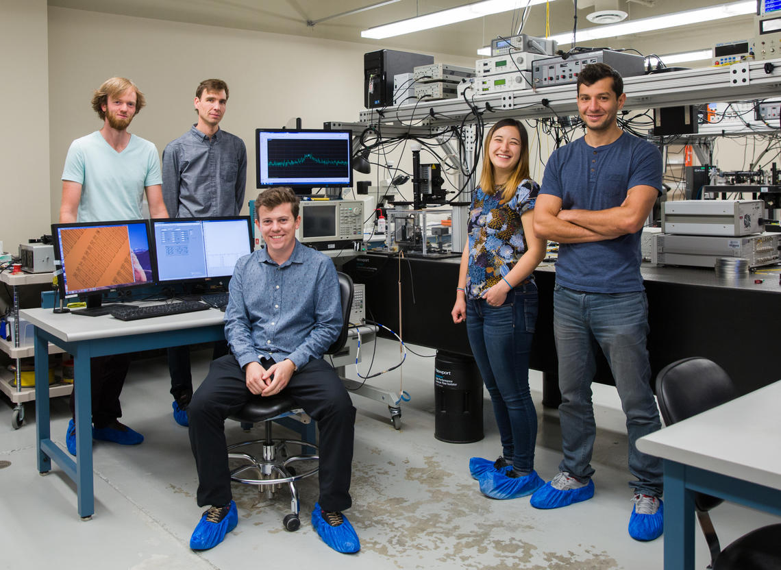 From left: David Lake, Paul Barclay, Matthew Mitchell, Tamiko Masuda, and Behzad Khanaliloo. Barclay, associate professor of physics and astronomy and Alberta Innovates Scholar in Quantum Nanotechnology in the Faculty of Science, and his students fabricated a quantum microdisk from commercially available synthetic, single-crystal diamond chips.