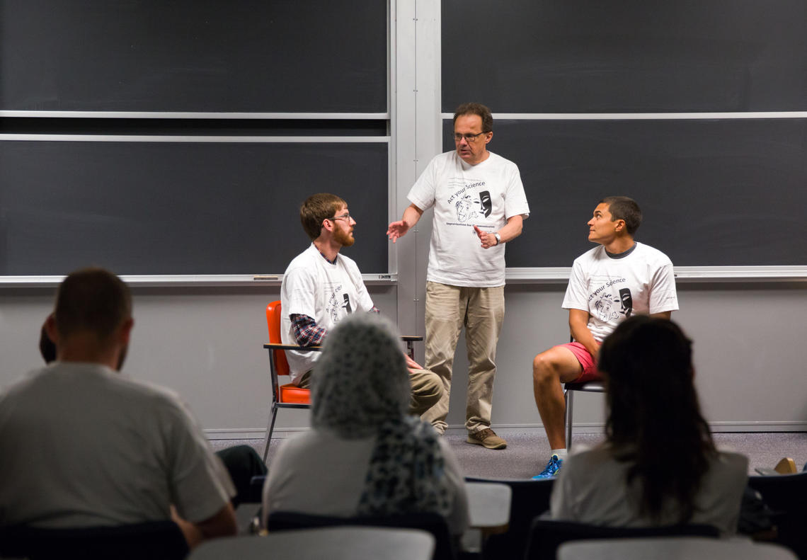 Dennis Cahill, centre, teaches science and technology students foundational skills for improvisation to improve their public speaking and science communication skills at the Act Your Science workshop. With him are students David Garett, left, and Andres Kroker.