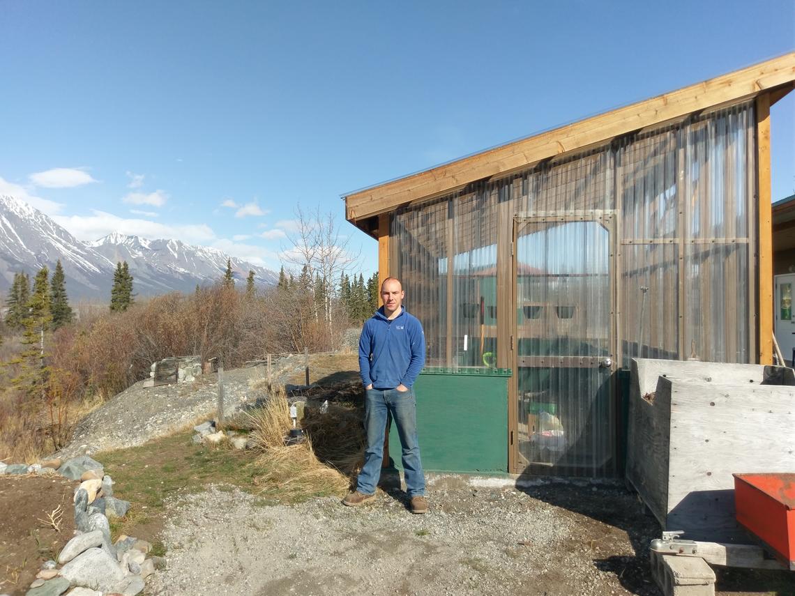 Henry Penn, a postdoctoral scholar with the University of Calgary-led Arctic Institute of North America, at the Kluane Lake Research Station where he is installing the Yukon’s first solar-powered Cropbox to try to grow fresh produce year-round. Photo by Robert Reich, Kluane Lake Research Station