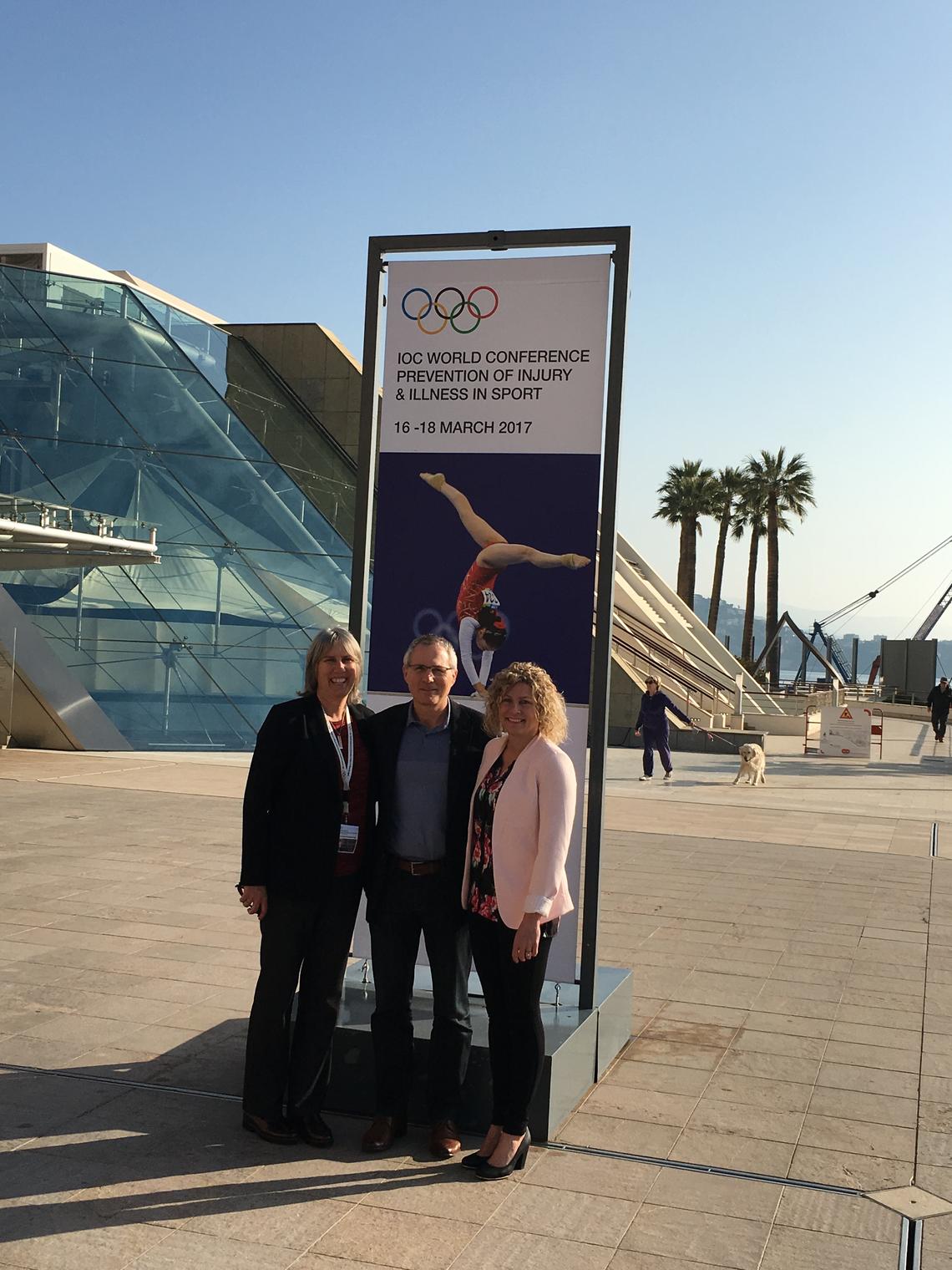 Carolyn Emery, left, Willem Meeuwisse, and Kathryn Schneider at the International Olympic Committee World Conference in Monaco in March.