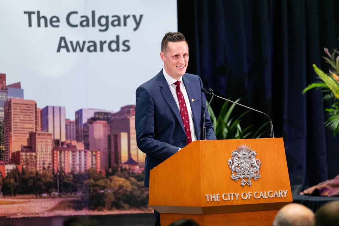 Leighton Wilks, instructor with the Haskayne School of Business, accepts the Community Achievement Award for education at the 2018 Calgary Awards.
