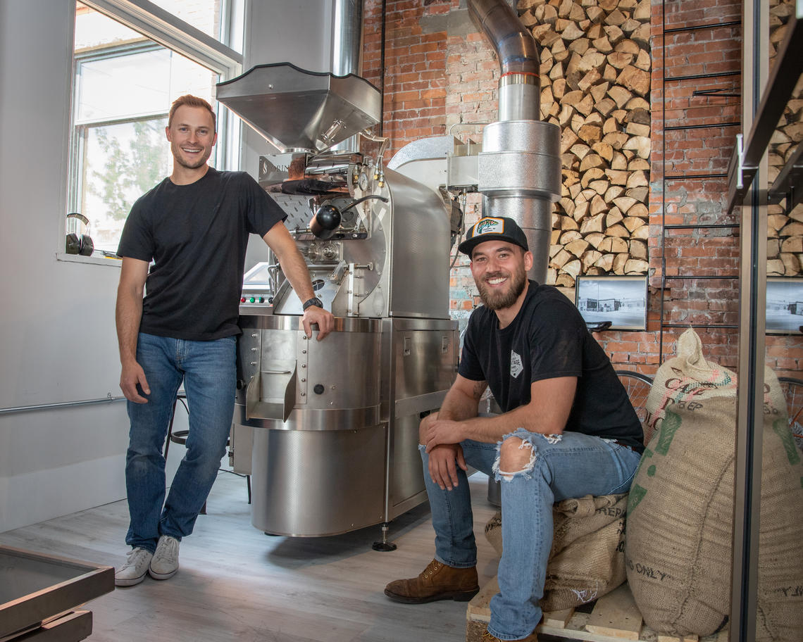 Two men inside a roasterie