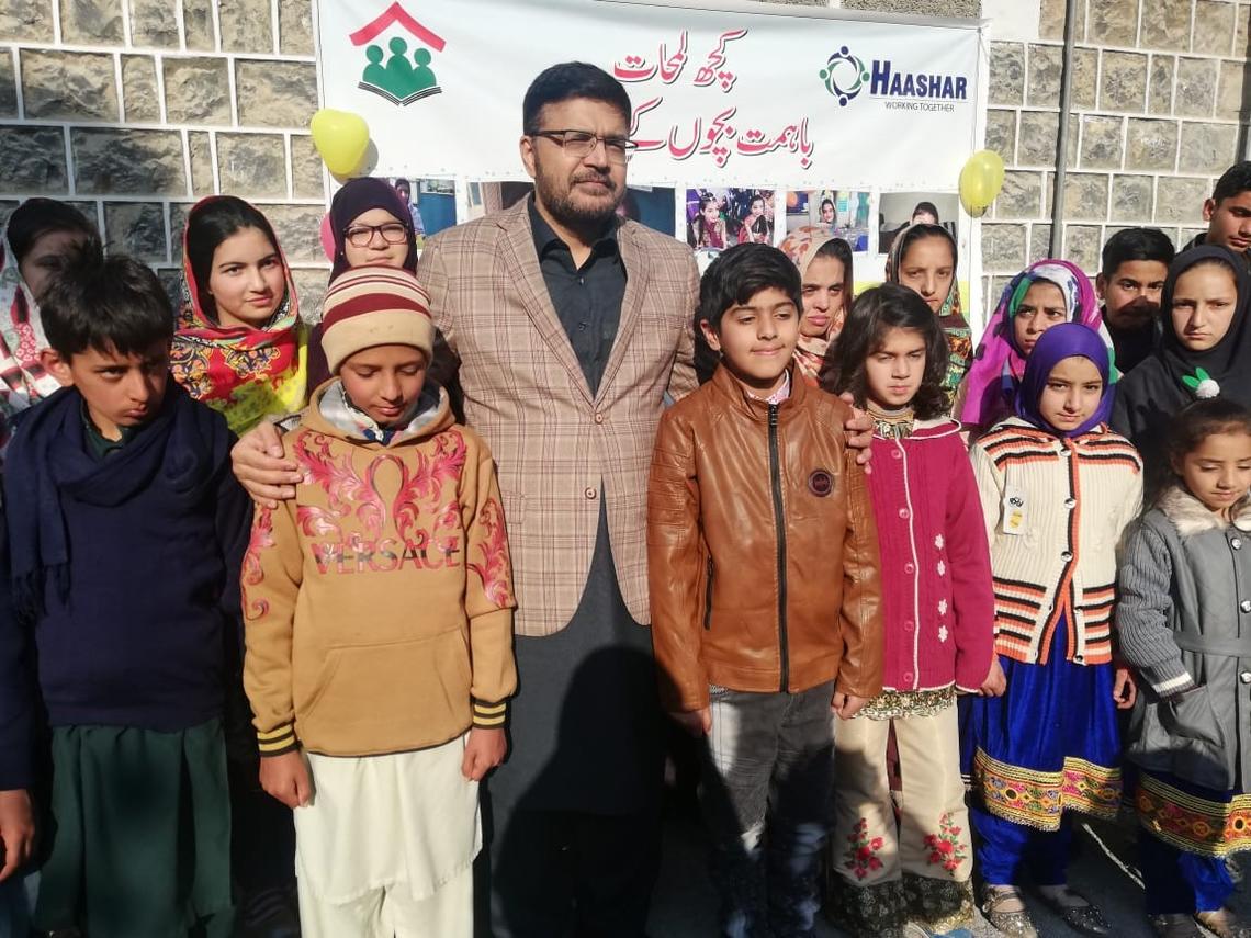 Professor Aamir Jamal with students in Abbottabad, Pakistan. 