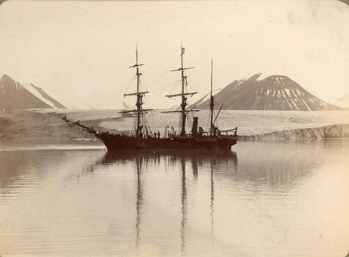 Photo of the Nova Zembla at anchor in front of a glacier, potentially Bylot Island, date unknown.