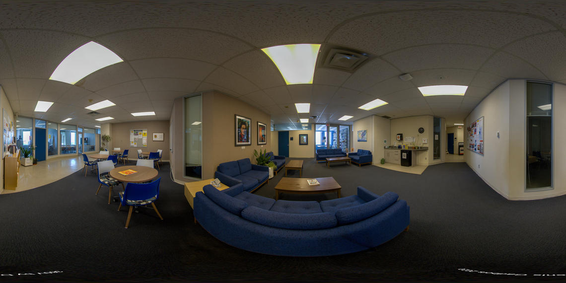 panorama of department's lounge space with chairs, couches and tables