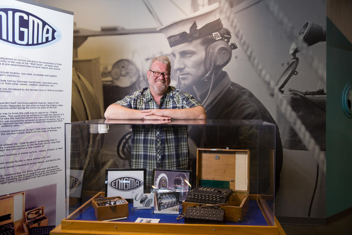 History Professor John Ferris has been named the “Authorized Historian” in chronicling the history of its British communications intelligence agency (Government Communications Headquarters). Ferris stands next to an Enigma machine, a type of enciphering machine used by the German armed forces to send messages securely.