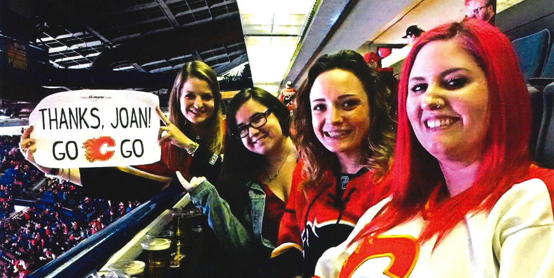 Fans of Joan express their support during a Calgary Humane Society event at the Saddledome.