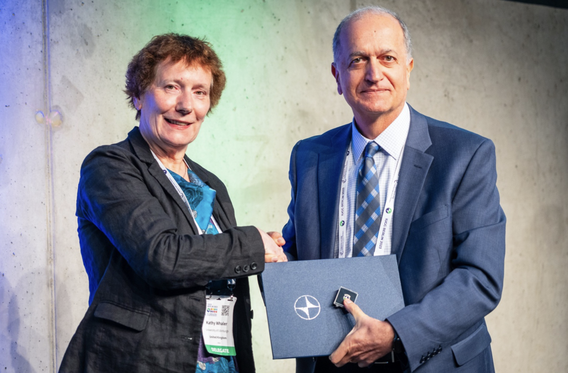 Dr. Sideris congratulated by the outgoing IUGG President, Prof. Kathryn Whaler