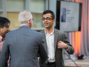 BHSc student and 2018 Rhodes Scholar Recipient Rahul Arora greets UCalgary President Dr. Ed McCauley and CSM Awards and Recognition committe chair Dr. Wee Yong.