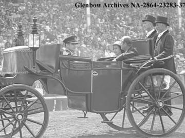 Queen and Duke of Edinburgh arriving by carriage at the Calgary Exhibition and Stampede grandstand, Calgary, Alberta