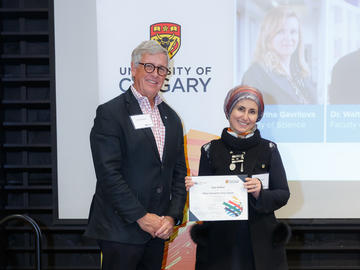 Dr Lina Kattan (Schulich School of Engineering), right, receives a Killam Annual Professor Award from Killam Trustee Jim Dinning