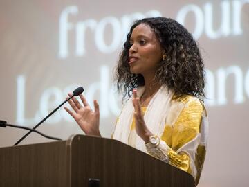 Sinit Abraha speaks during the ceremony