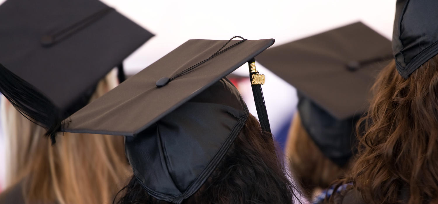 Stock image of graduands wearing grad hats