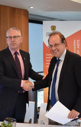 Ed McCauley, vice-president (research) at the University of Calgary, left, shakes hands with Jürgen Renn, director of the Max Planck Institute for the History of Science, on the occasion of a new research partnership between the two institutions.