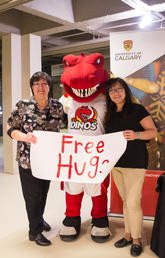 Rex is a fierce supporter of the Campus Mental Health Strategy — and here he walks the talk with his friends Karen MacDonald, left, and Jennifer Kzionzena from the Native Centre. Photo by Riley Brandt, University of Calgary