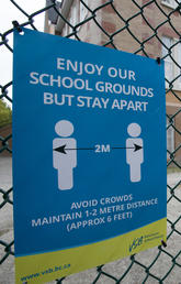 A physical distancing sign is seen at Hastings Elementary school in Vancouver, Sept. 2, 2020.