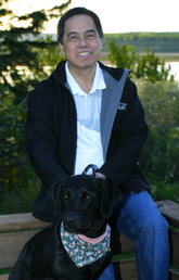 Dr. Bernie Law, PhD with his dog Savannah