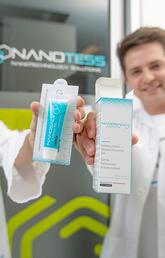 Two people holding up nanotess