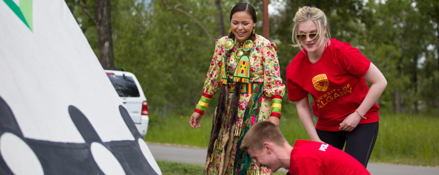 The University of Calgary and the Calgary Stampede hosts Campfire Chats in recognition of National Aboriginal Day. Blackfoot Elder Reg Crowshoe leads guests in tipi-raising and tipi-painting demonstration.