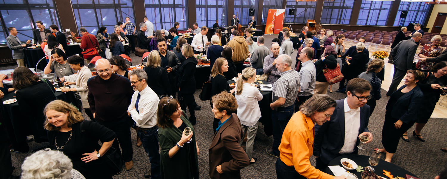 People mill about at a reception
