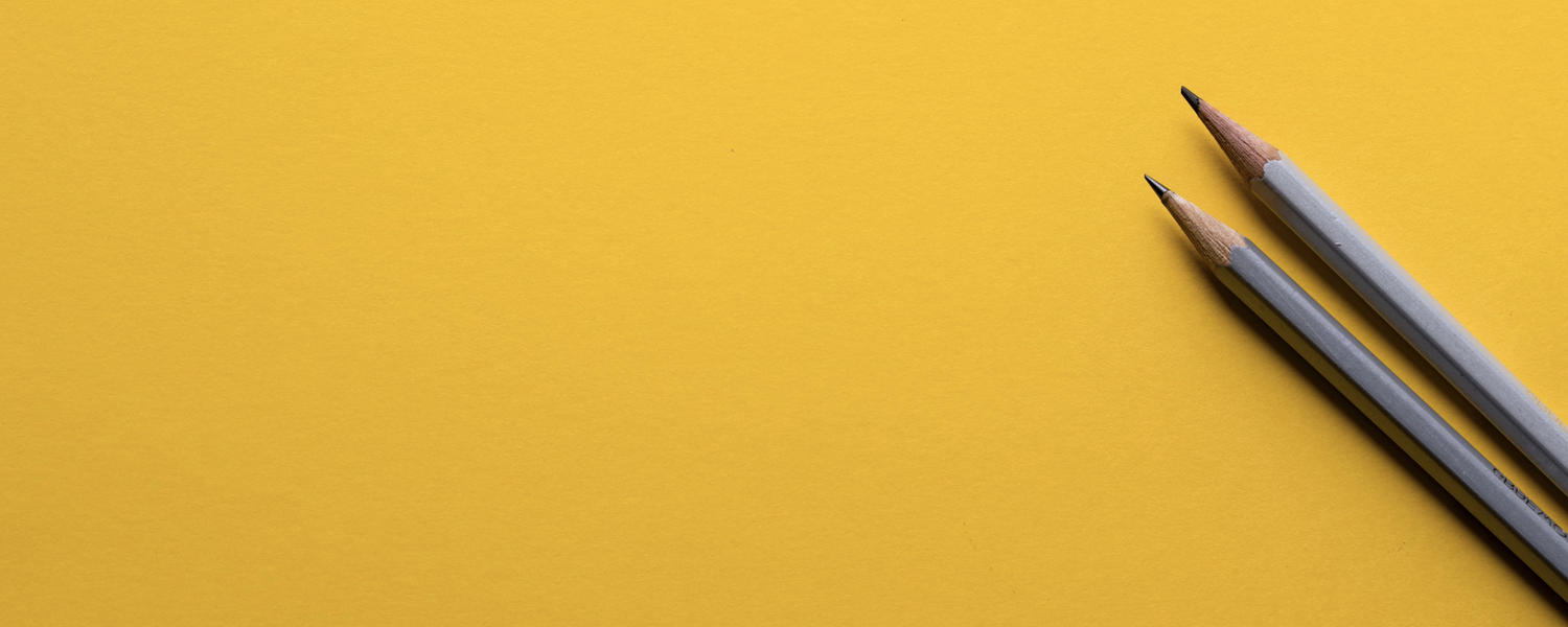 Image of two pencils on a yellow background. Photo by Joanna Kosinska.