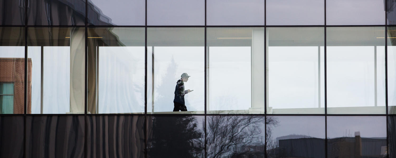 Student walking through the +15 on campus