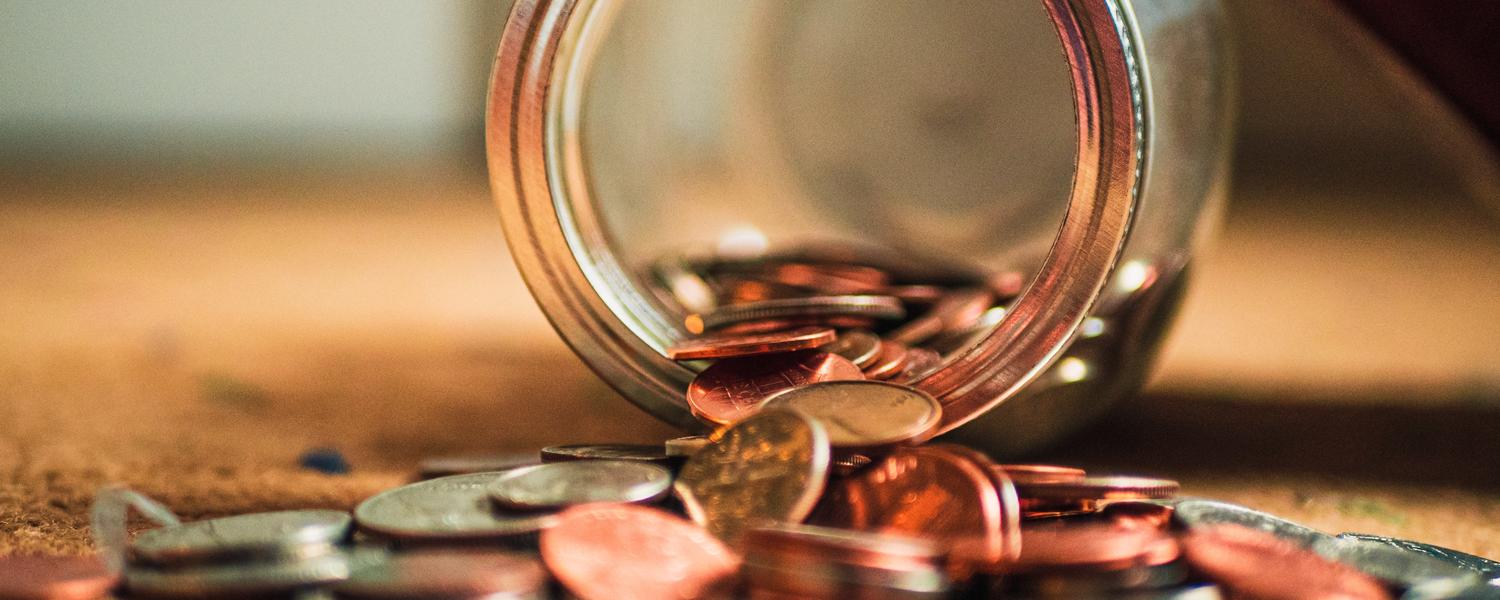 Jar of pennies dumped out