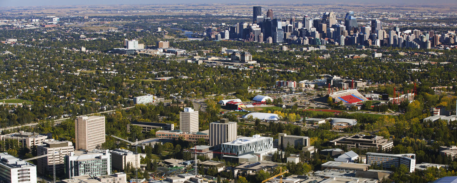 Aerial shot of Calgary showing the campus with the downtown buildings in the distance