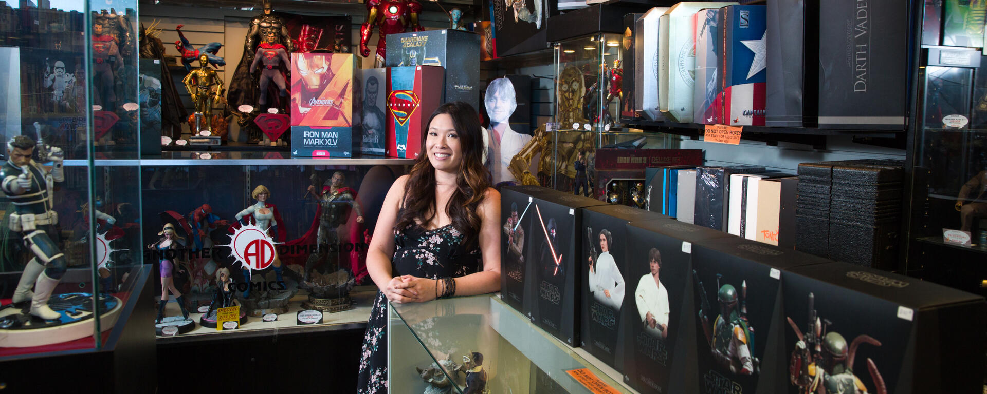 A woman stands in a comic book store