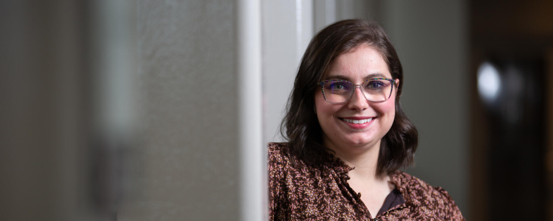 A smiling graduate student