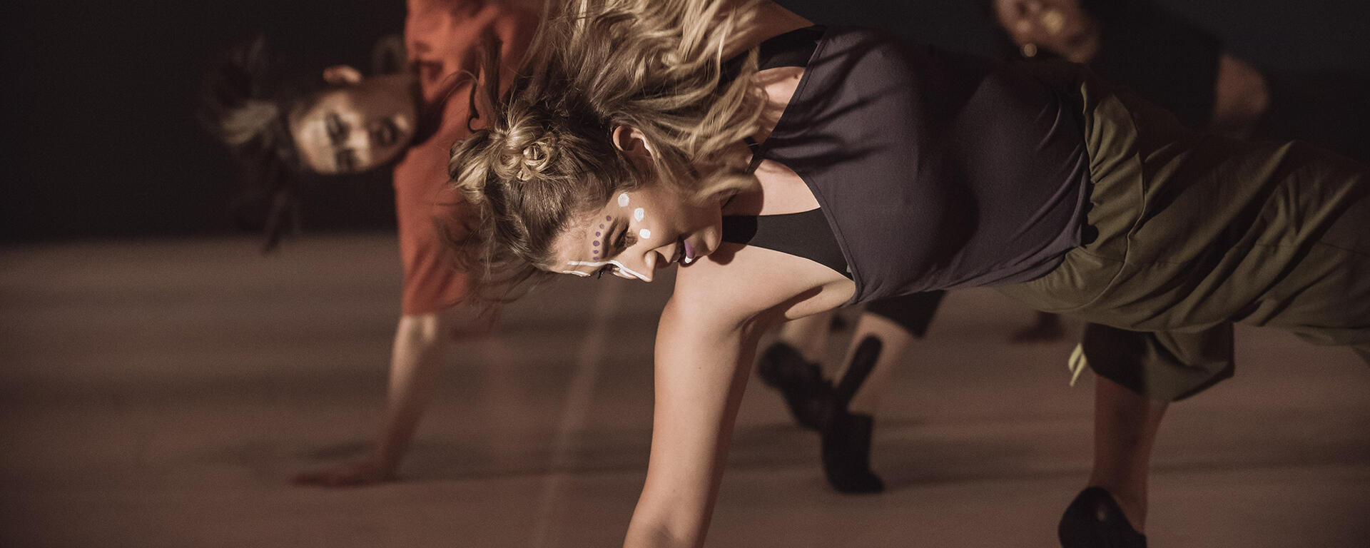 Students dance onstage during Mainstage 2019
