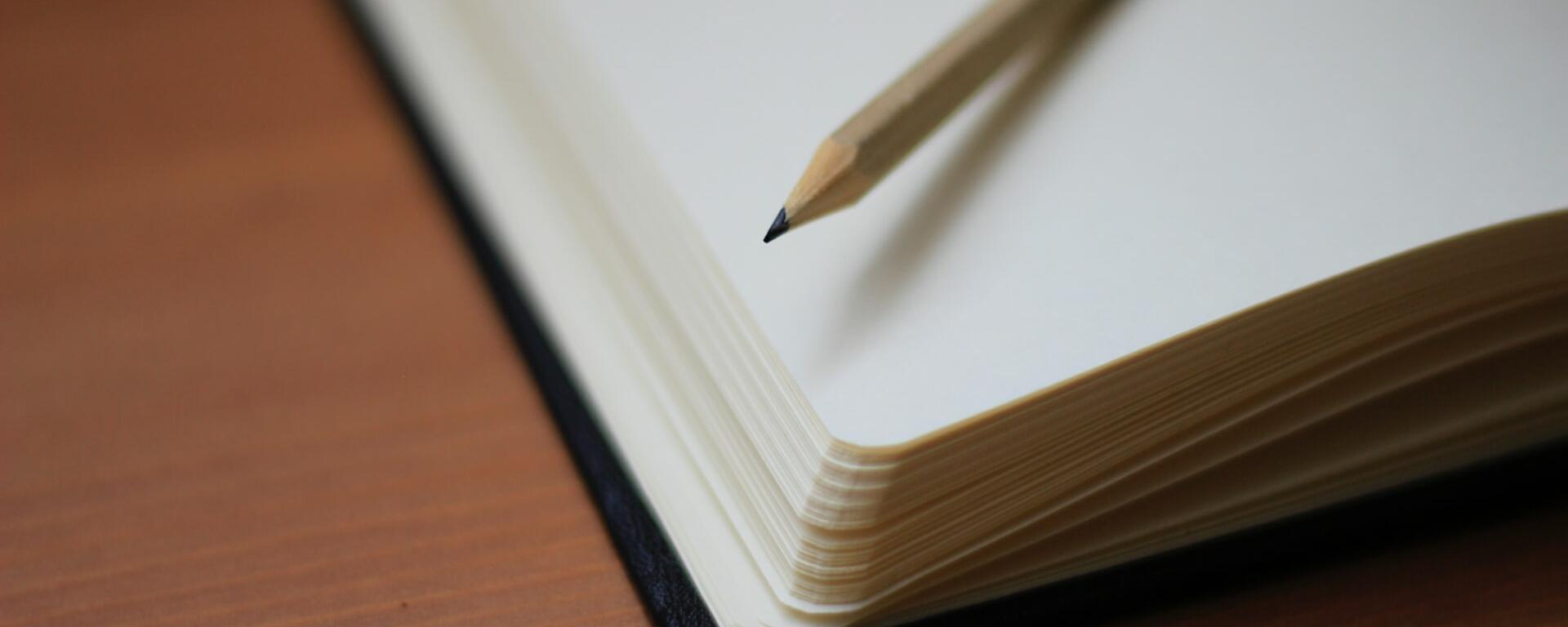 Notebook and pencil