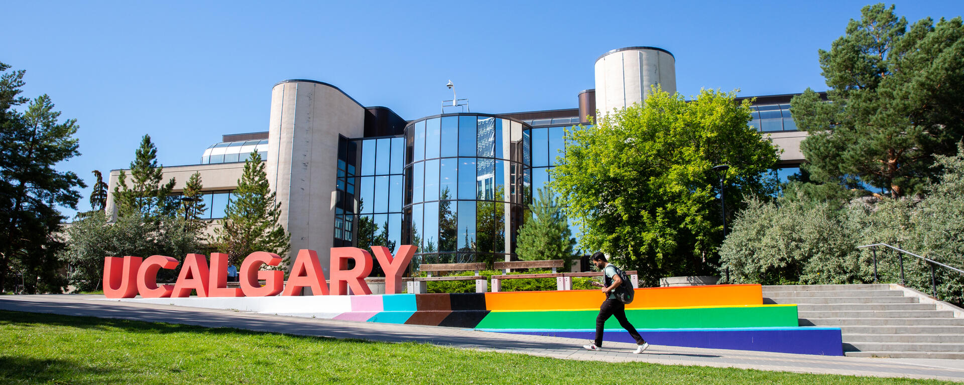 Mac Hall featuring a UCalgary sign and the Pride flag
