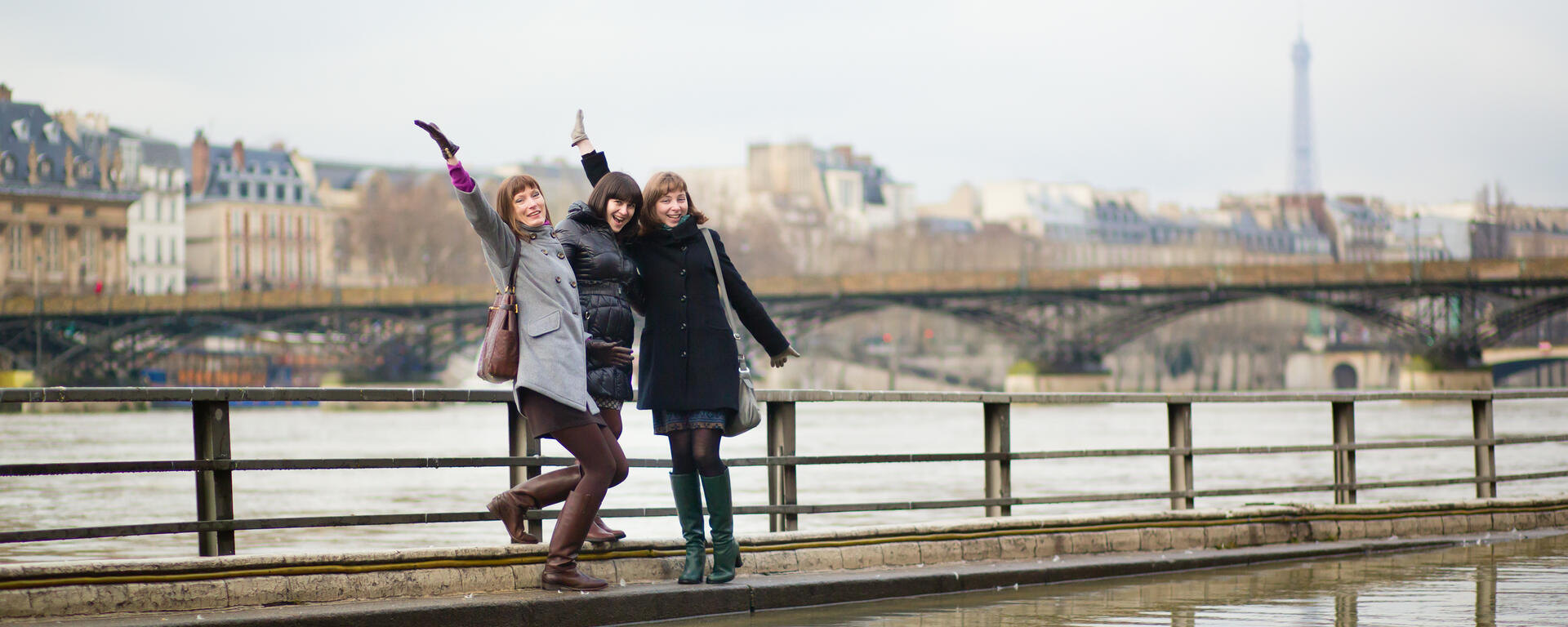 Colourbox stock photo of young women waving on a bridge in Paris