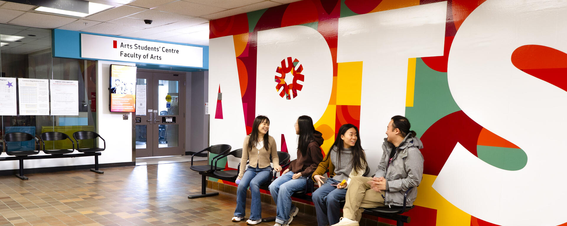 Students sit near the Arts Students' Centre