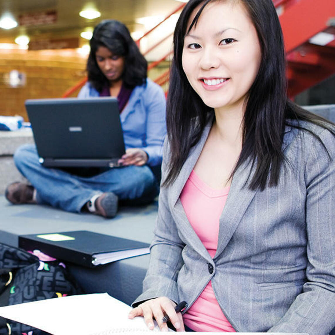 A group of students sit and study together
