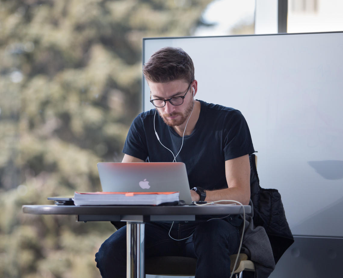 A male student studies in the library