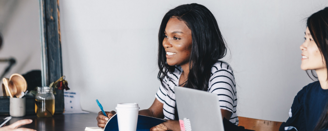 Stock image of a young Black woman in class