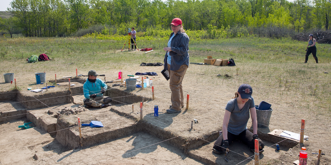 A group of student digging a site for archaeology research