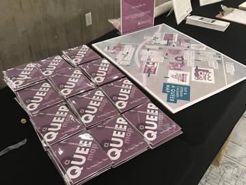 An assortment of maps is arrayed on a table