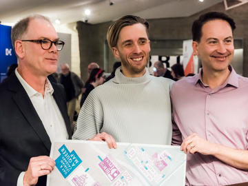 Institute Director Jim Ellis, artist Mark Clintberg, and Kevin Allen smile and pose together