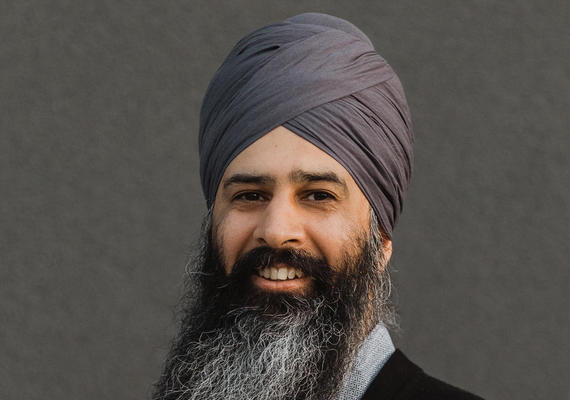 Headshot of Dr. Harjeet Grewal, who wears a suit and a turban