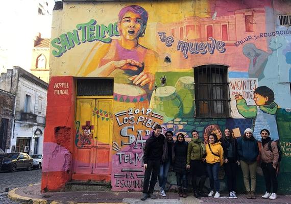 students in front of painted San Telmo building