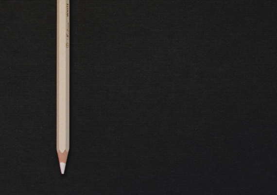 A black background with a white pencil