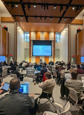 shot of conference attendes from back of room