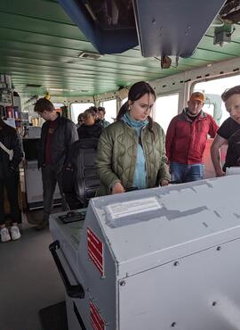 CMSS graduate student driving the navy patrol vessel Yellowknife