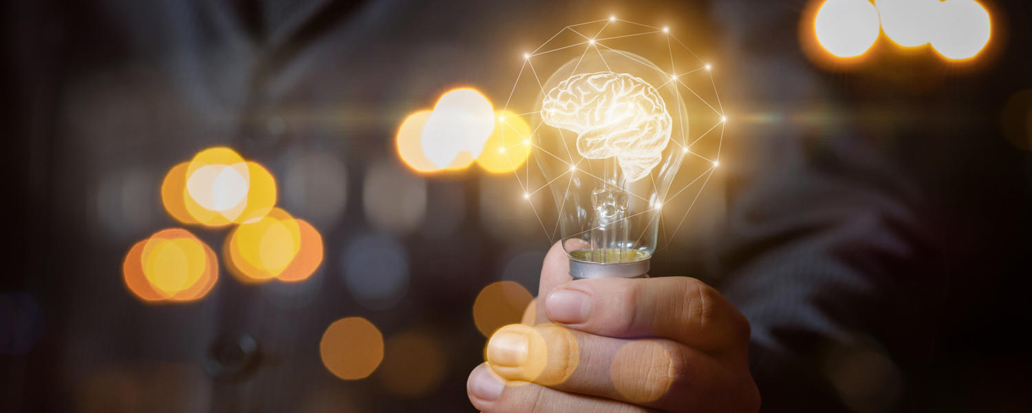 graphic of brain in lightbulb; iStock image by Natali_Mis