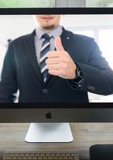 Computer with man giving thumbs up