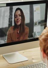 Woman on video call with young boy